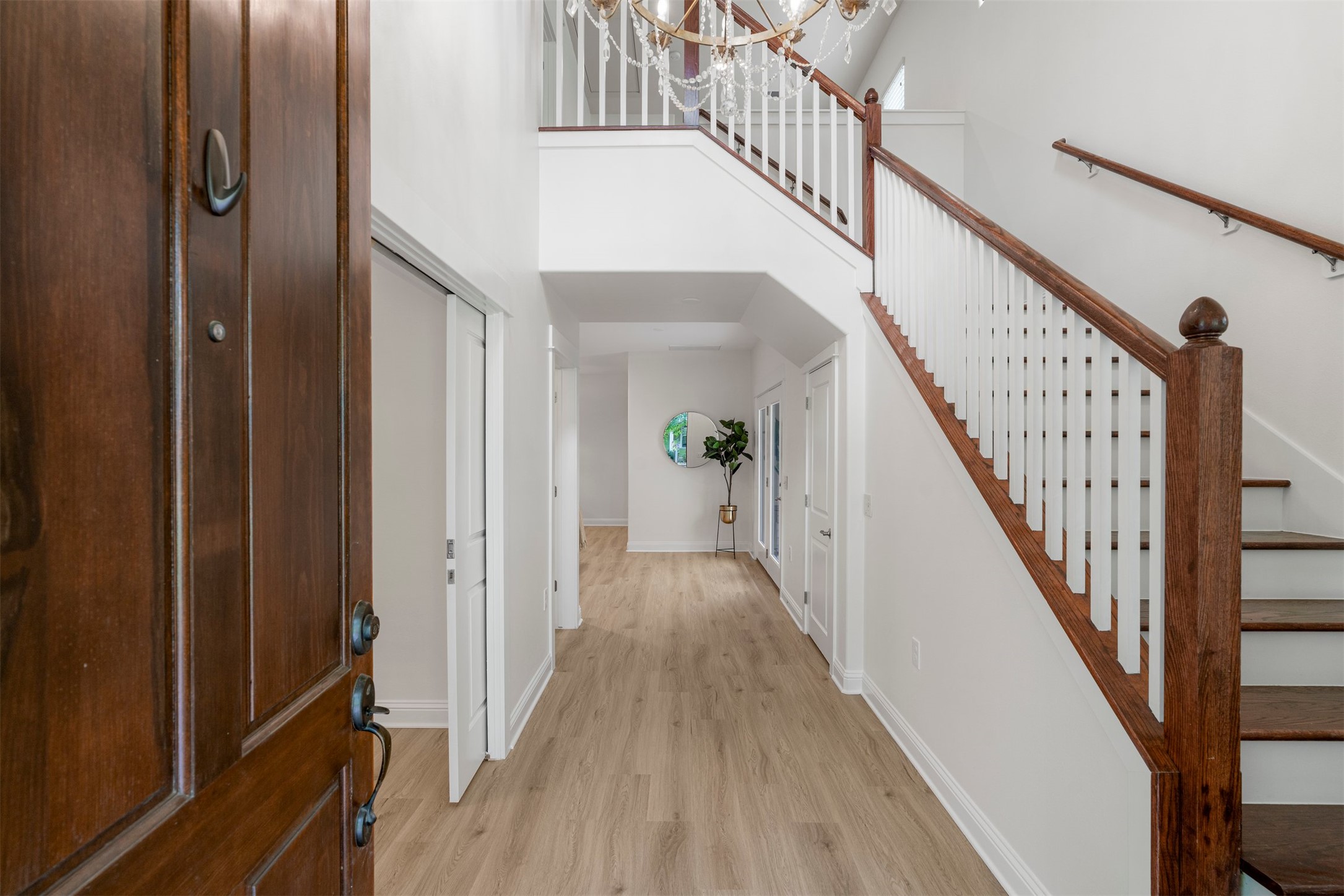 4216 Threadgill Street Austin, TX 78723 - Photo 13 of 40 a view of a hallway with wooden floor and entryway