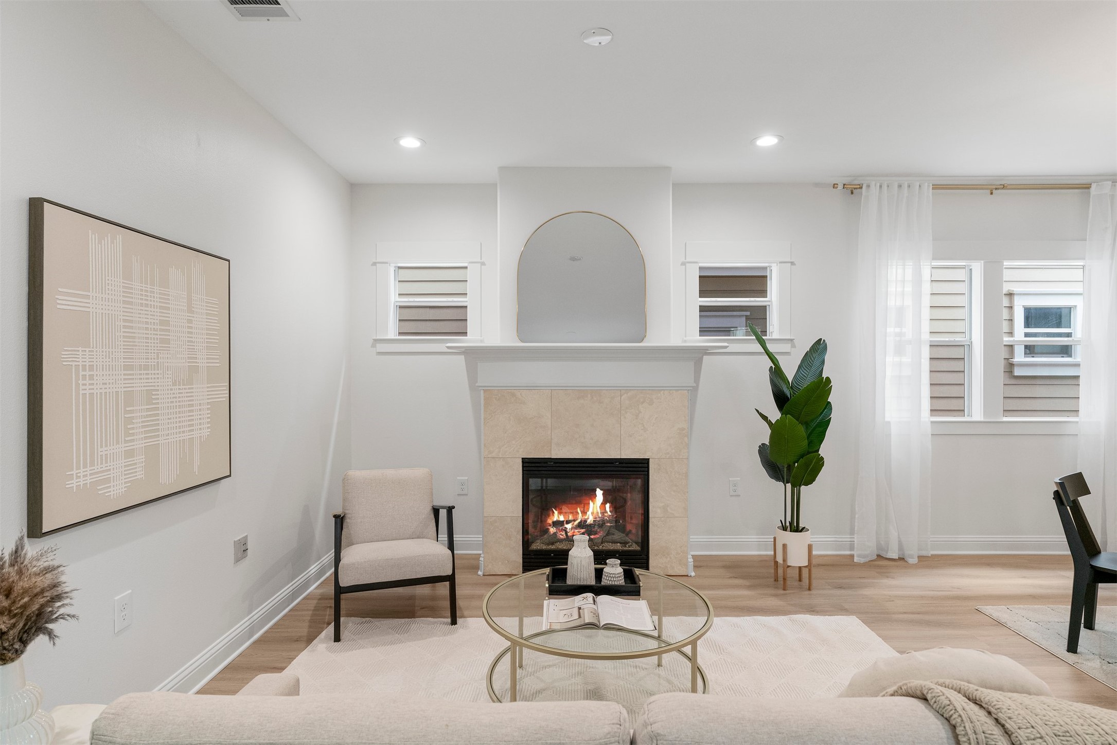 4216 Threadgill Street Austin, TX 78723 - Photo 14 of 40 a living room with furniture and a fireplace