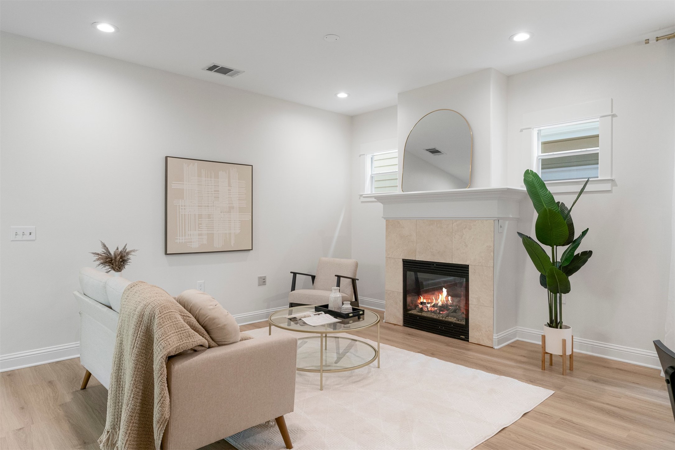 4216 Threadgill Street Austin, TX 78723 - Photo 15 of 40 a living room with furniture and a fireplace