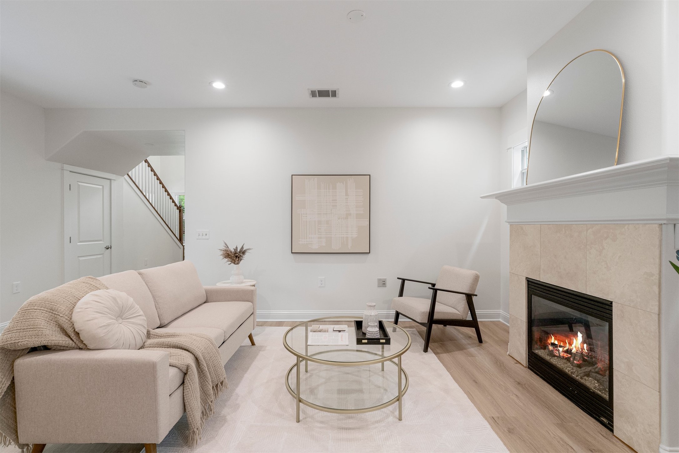 4216 Threadgill Street Austin, TX 78723 - Photo 16 of 40 a living room with furniture and a fireplace