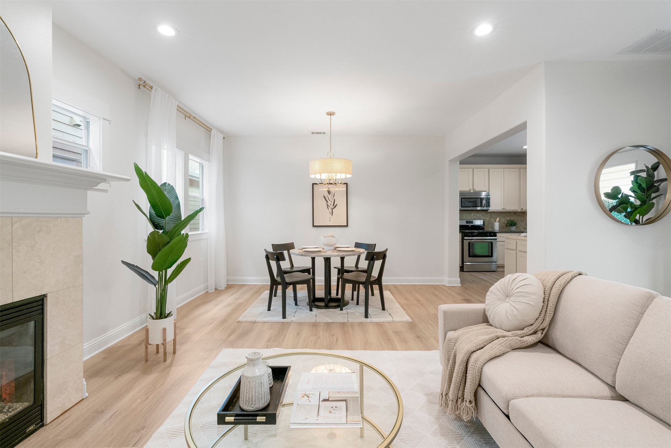4216 Threadgill Street Austin, TX 78723 - Photo 17 of 40 a living room with furniture a wooden floor and a potted plant
