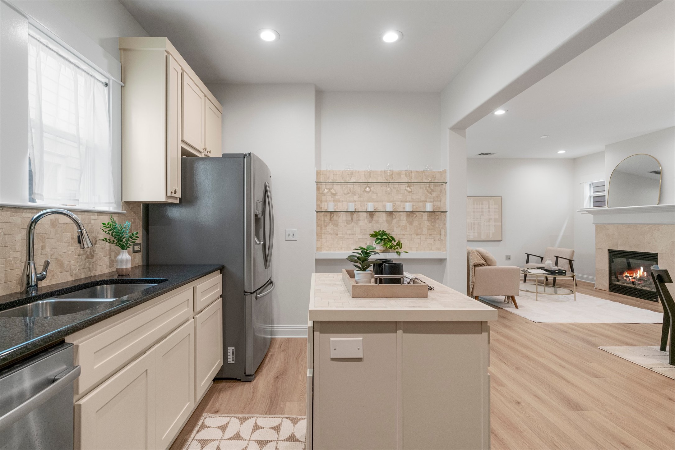 4216 Threadgill Street Austin, TX 78723 - Photo 24 of 40 a kitchen with a refrigerator and a sink