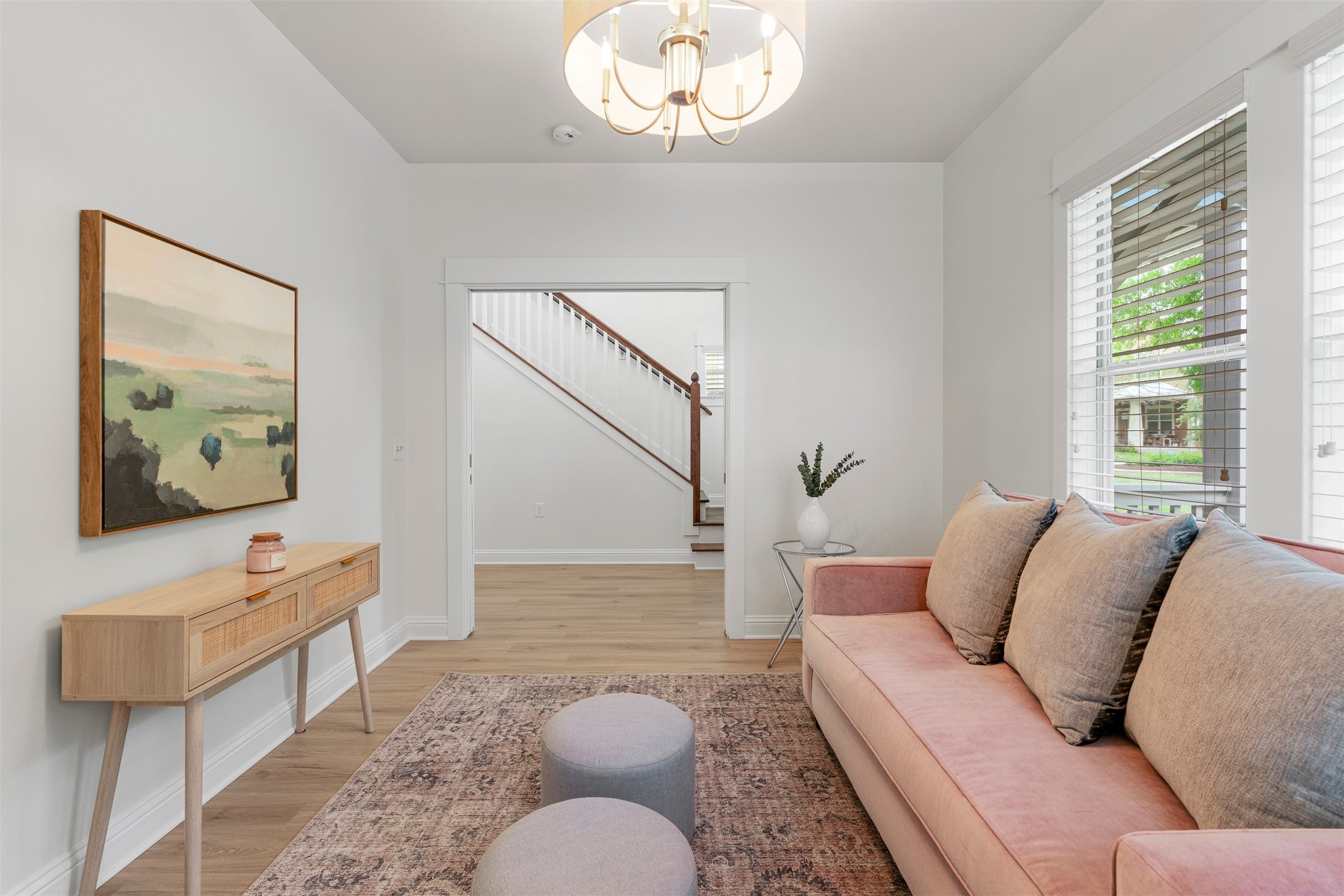 4216 Threadgill Street Austin, TX 78723 - Photo 26 of 40 a living room with furniture a rug and a window