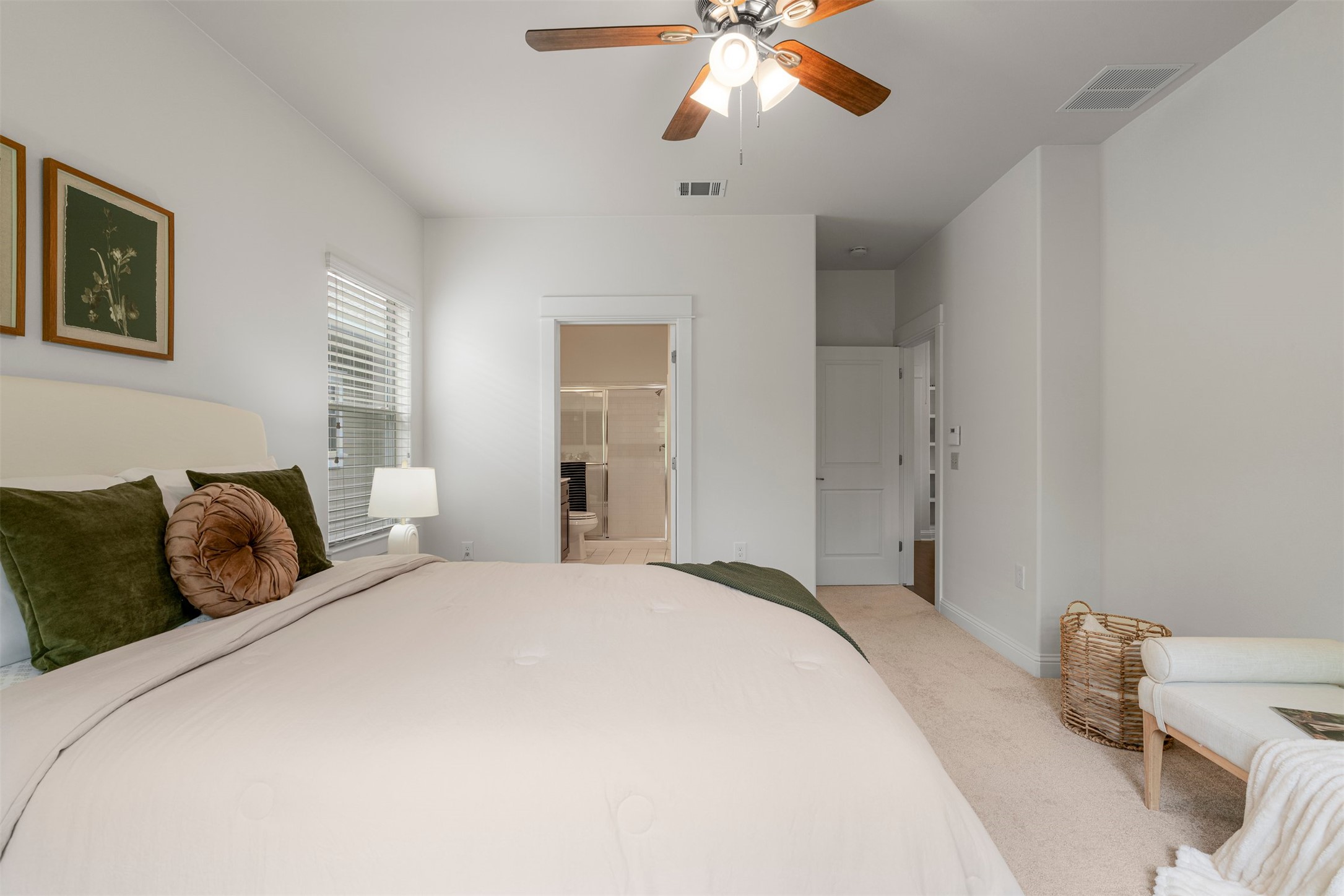 4216 Threadgill Street Austin, TX 78723 - Photo 29 of 40 a bedroom with a bed and a chandelier