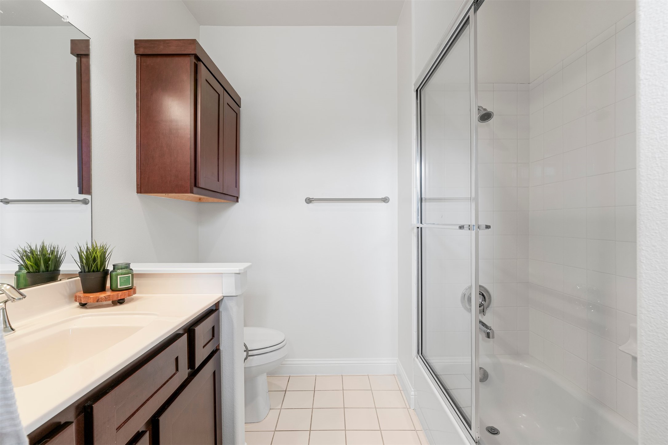 4216 Threadgill Street Austin, TX 78723 - Photo 34 of 40 a bathroom with a sink a toilet and shower