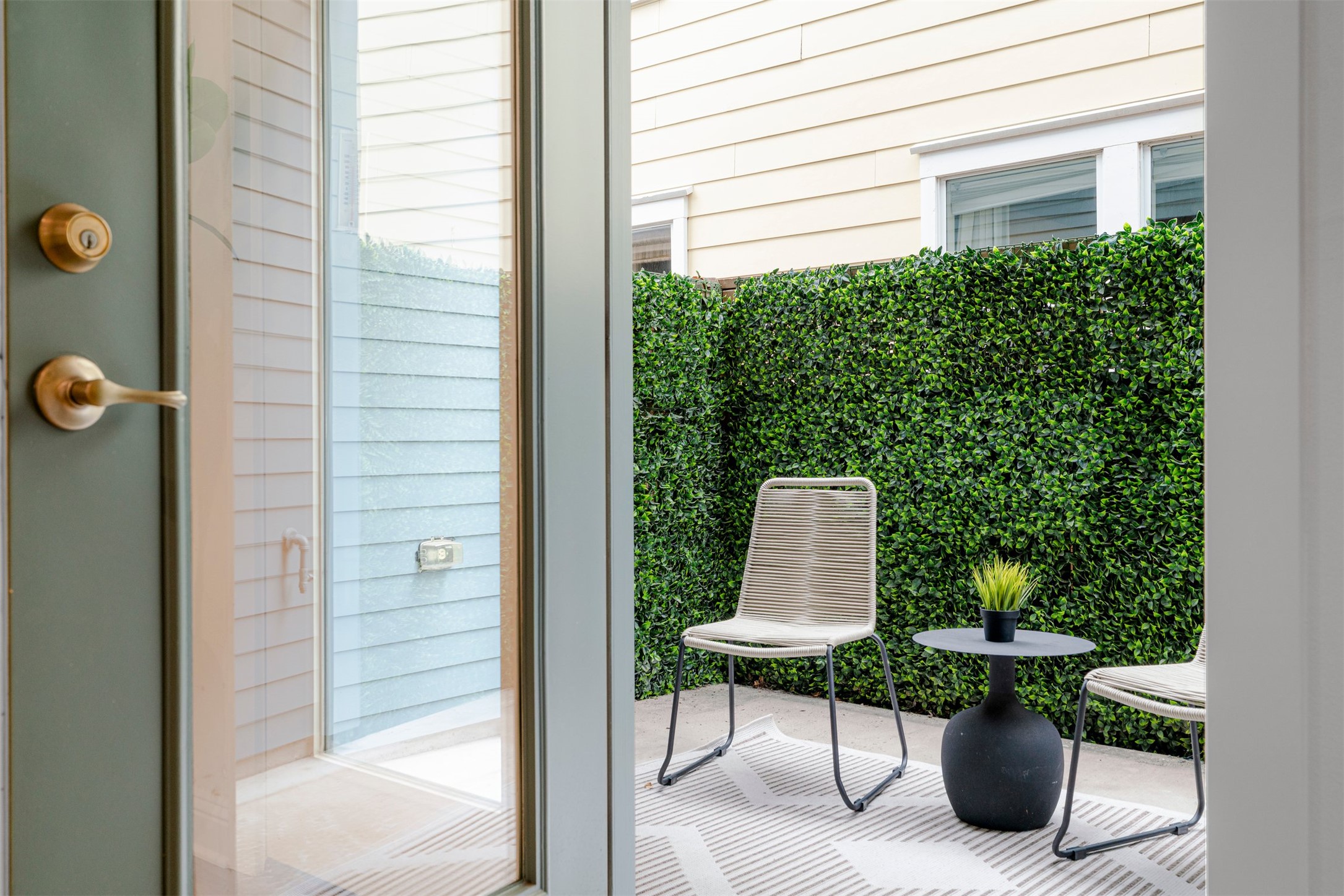 4216 Threadgill Street Austin, TX 78723 - Photo 37 of 40 a view of a patio with table and chairs and potted plants