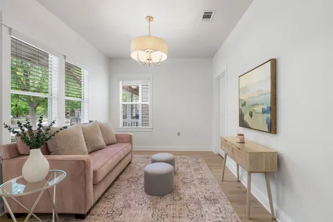a living room with furniture and a window