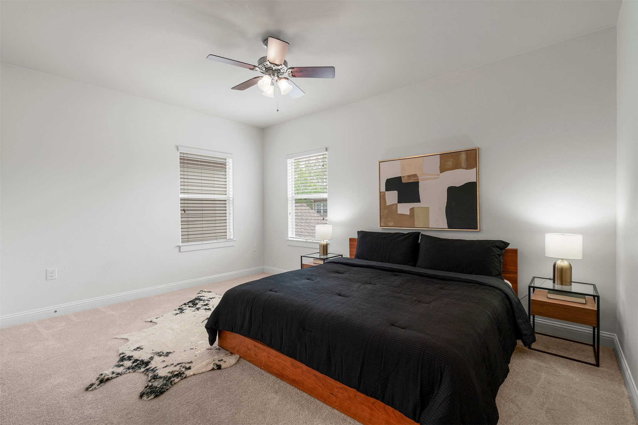 4216 Threadgill Street Austin, TX 78723 - Photo 8 of 40 a bedroom with a bed and a chandelier