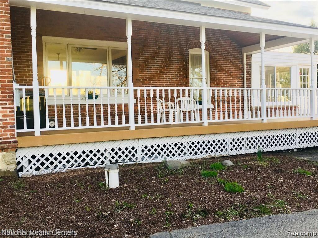 3920 East Commerce Road Commerce Township, MI 48382 - Photo 6 of 36 Covered porch over looking the lake
