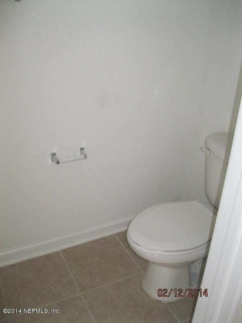 6700 Bowden Road, Unit 1605 Jacksonville, FL 32216 - Photo 4 of 9 a white toilet sitting next to a white sink