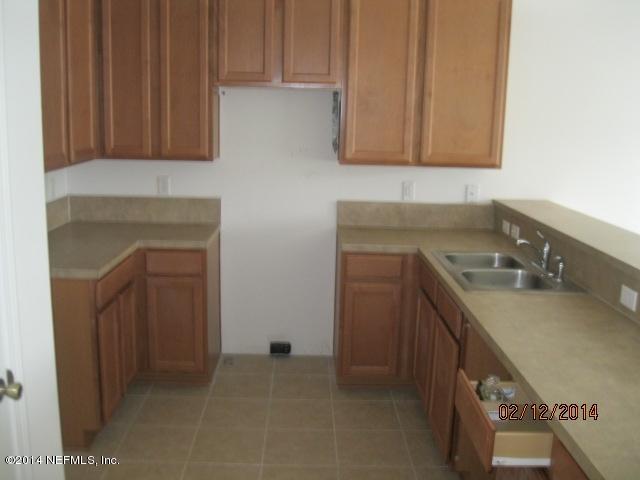 6700 Bowden Road, Unit 1605 Jacksonville, FL 32216 - Photo 5 of 9 a kitchen with a sink and cabinets