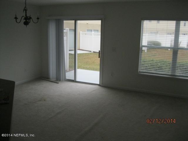 6700 Bowden Road, Unit 1605 Jacksonville, FL 32216 - Photo 6 of 9 a view of an empty room with a window