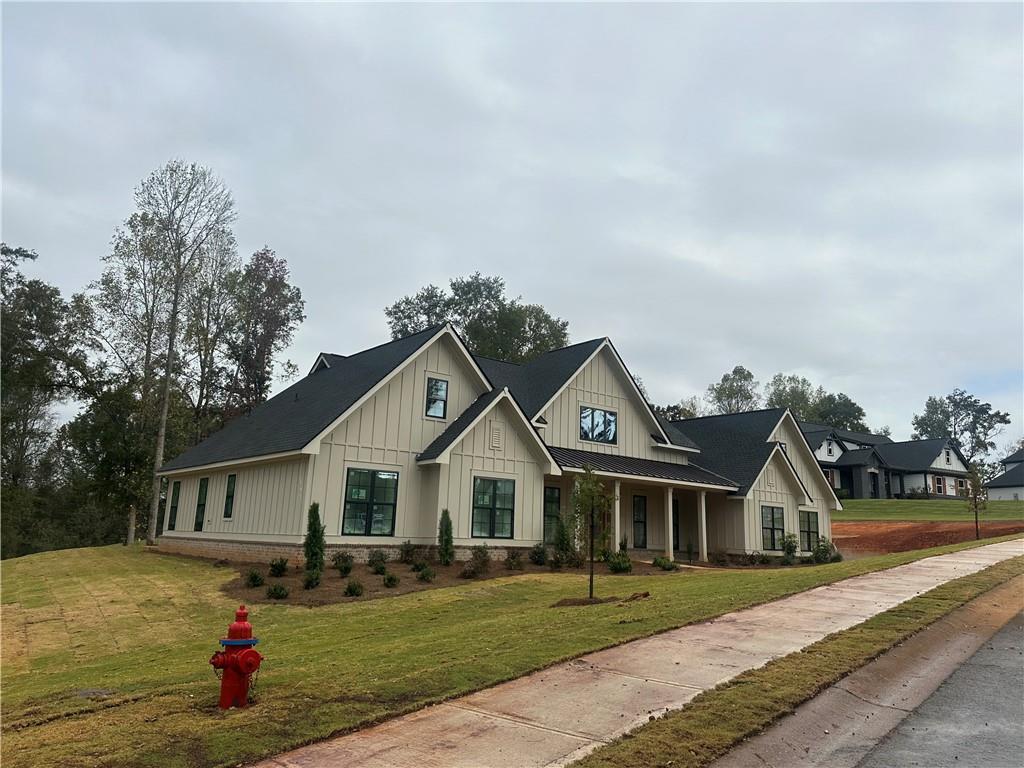 1254 Mulberry Chase Commerce, GA 30530 - Photo 2 of 10 a front view of a house with a yard