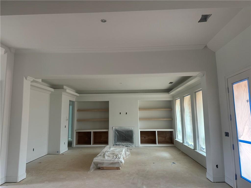 1254 Mulberry Chase Commerce, GA 30530 - Photo 5 of 10 an empty room with fireplace and window