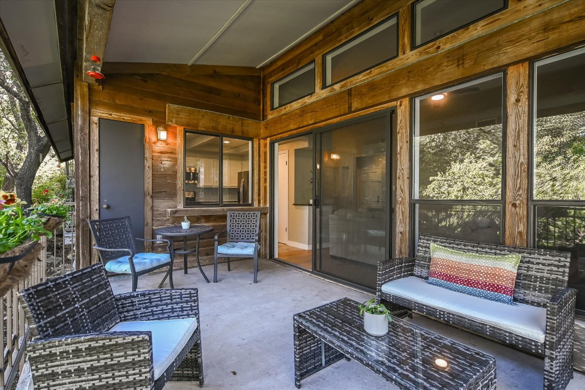 8200 Neely Drive, Unit 206 Austin, TX 78759 - Photo 17 of 26 a building outdoor space with patio furniture and glass door