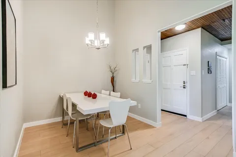 a dining room with furniture and window