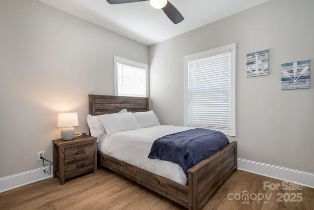 a bedroom with a bed and window