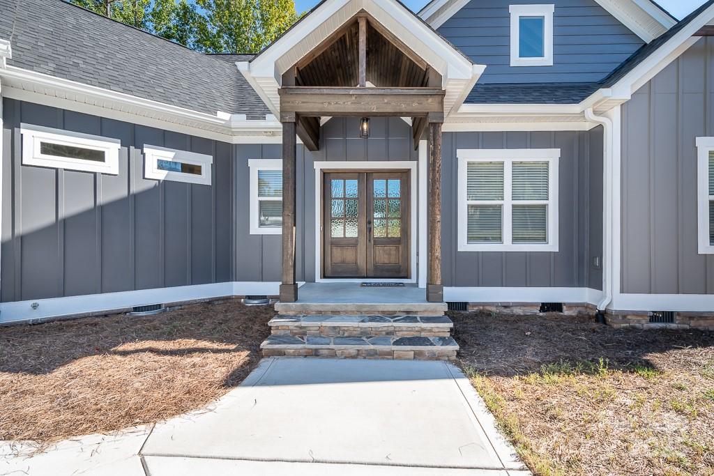 787 Morrison Farm Road Troutman, NC 28166 - Photo 2 of 24 a front view of a house with a yard