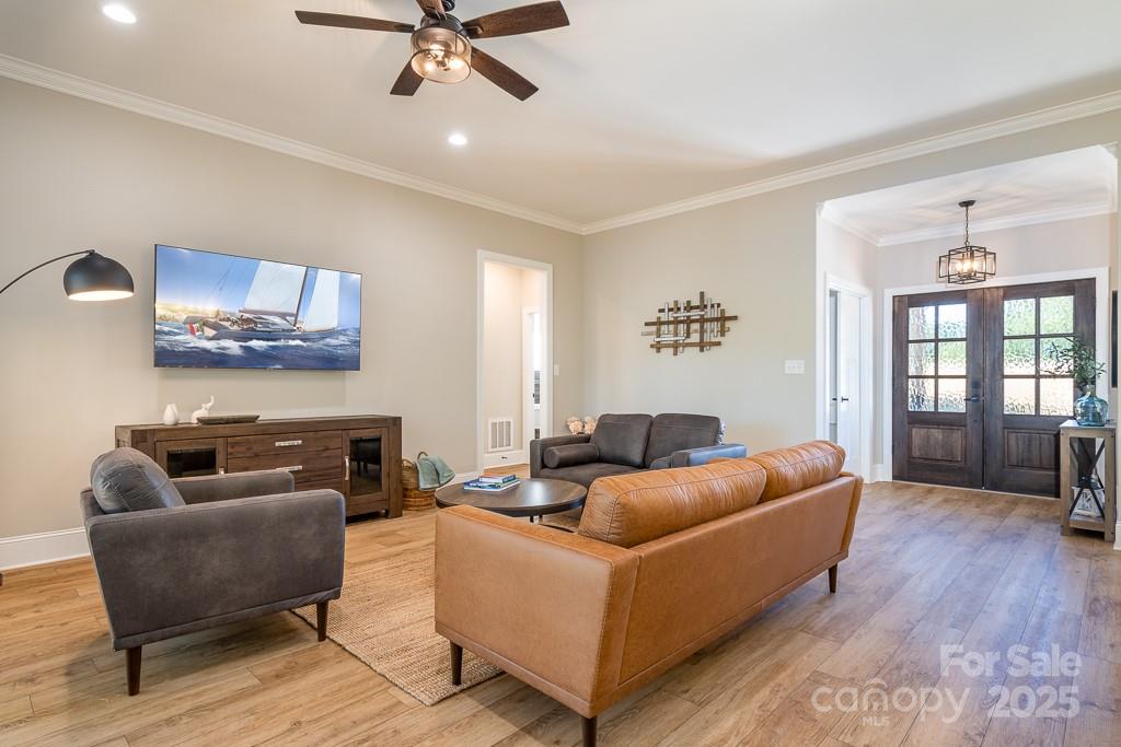 787 Morrison Farm Road Troutman, NC 28166 - Photo 9 of 24 a living room with furniture and a ceiling fan