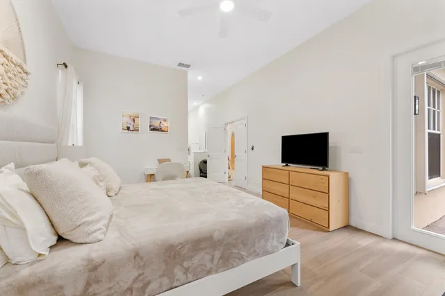 a dining room with furniture and wooden floor