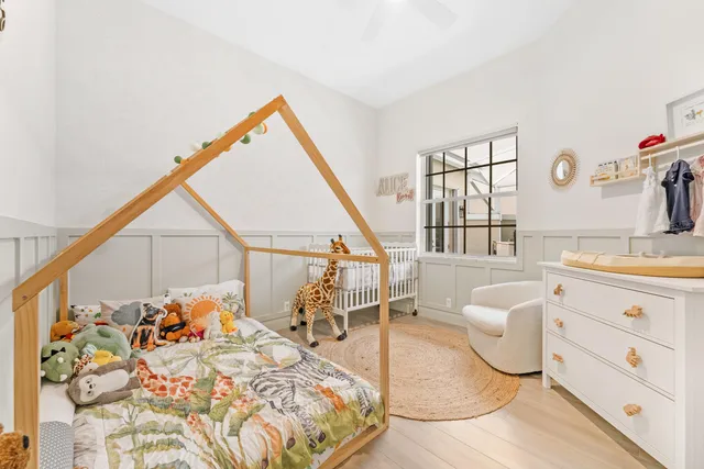 a spacious bedroom with a bed and a sink