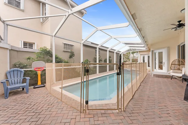 a view of a house with pool table and chairs