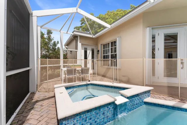 a view of a house with wooden floor and a small yard