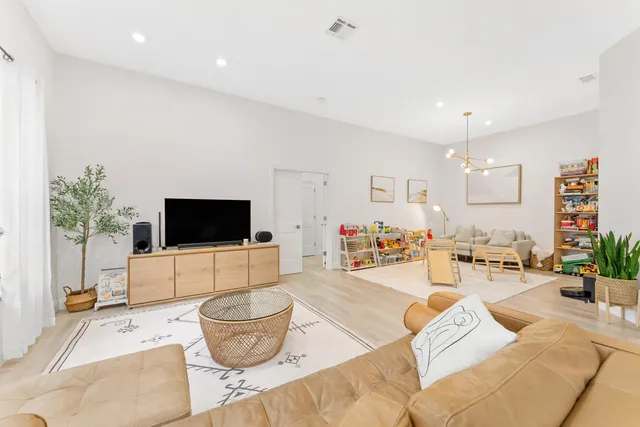 a living room with furniture and a table