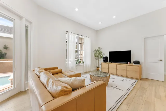 a kitchen with granite countertop a stove top oven sink and cabinets