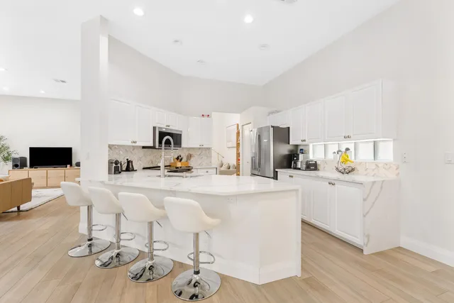 a kitchen with a sink stove and microwave