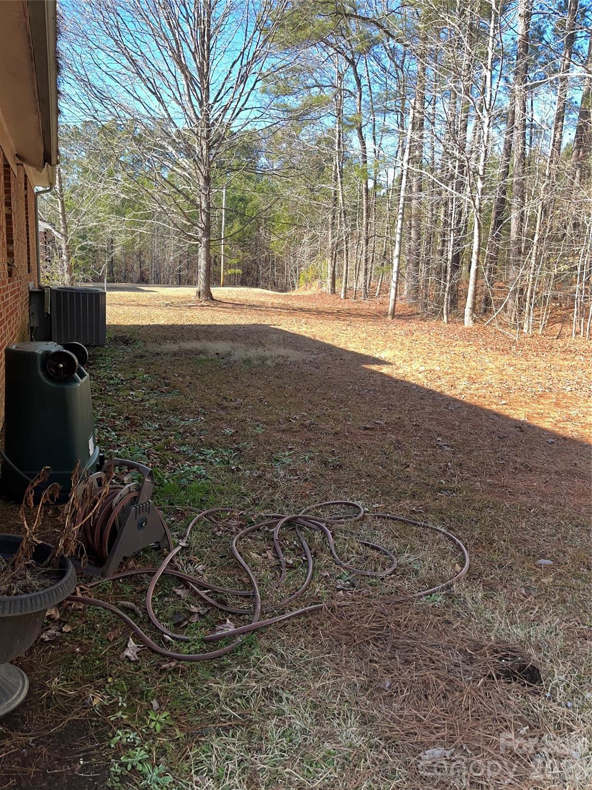 6957 Vintage Road Lilesville, NC 28091 - Photo 3 of 10 a view of a backyard with wooden fence