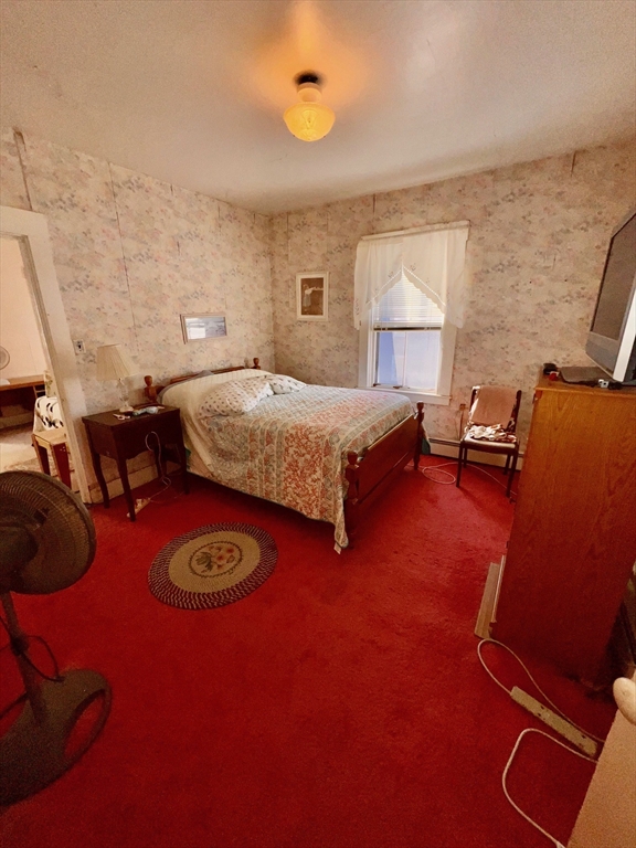 7 Myrtle Street Middleboro, MA 02346 - Photo 11 of 21 a bedroom with a bed and a lamp with the dresser