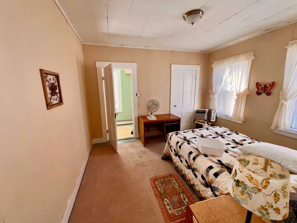 7 Myrtle Street Middleboro, MA 02346 - Photo 12 of 21 a bedroom with a bed and a couch