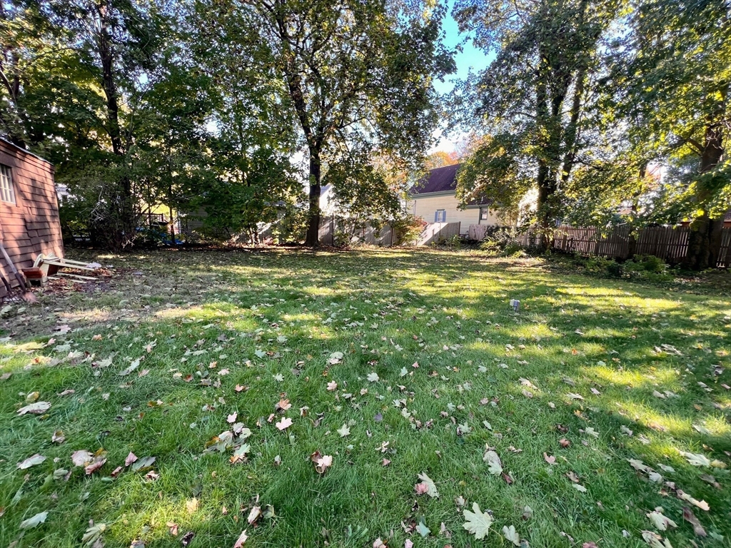 7 Myrtle Street Middleboro, MA 02346 - Photo 20 of 21 a backyard of a house with a table and chairs