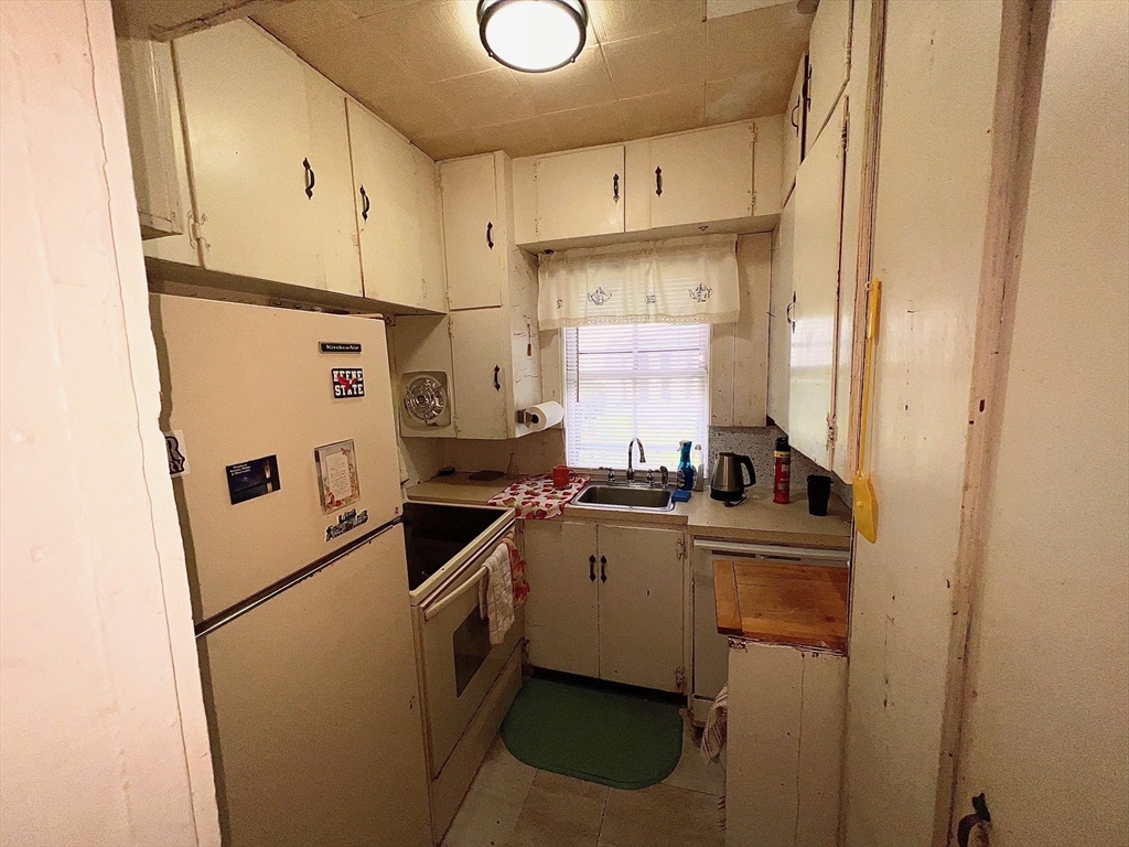 7 Myrtle Street Middleboro, MA 02346 - Photo 6 of 21 a white refrigerator freezer sitting in a kitchen