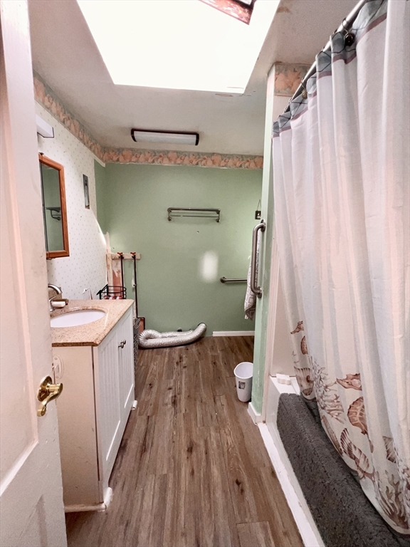 7 Myrtle Street Middleboro, MA 02346 - Photo 9 of 21 a view of a bathroom with a sink and wooden floor