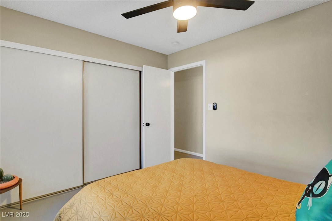 3215 Mountain Spring Road Las Vegas, NV 89146 - Photo 22 of 42 Bedroom featuring a closet and a ceiling fan