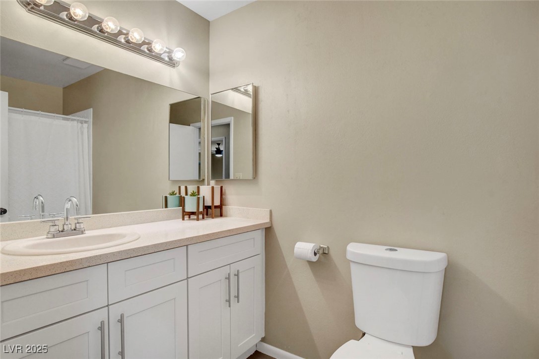 3215 Mountain Spring Road Las Vegas, NV 89146 - Photo 26 of 42 Bathroom with vanity and a shower with shower curtain