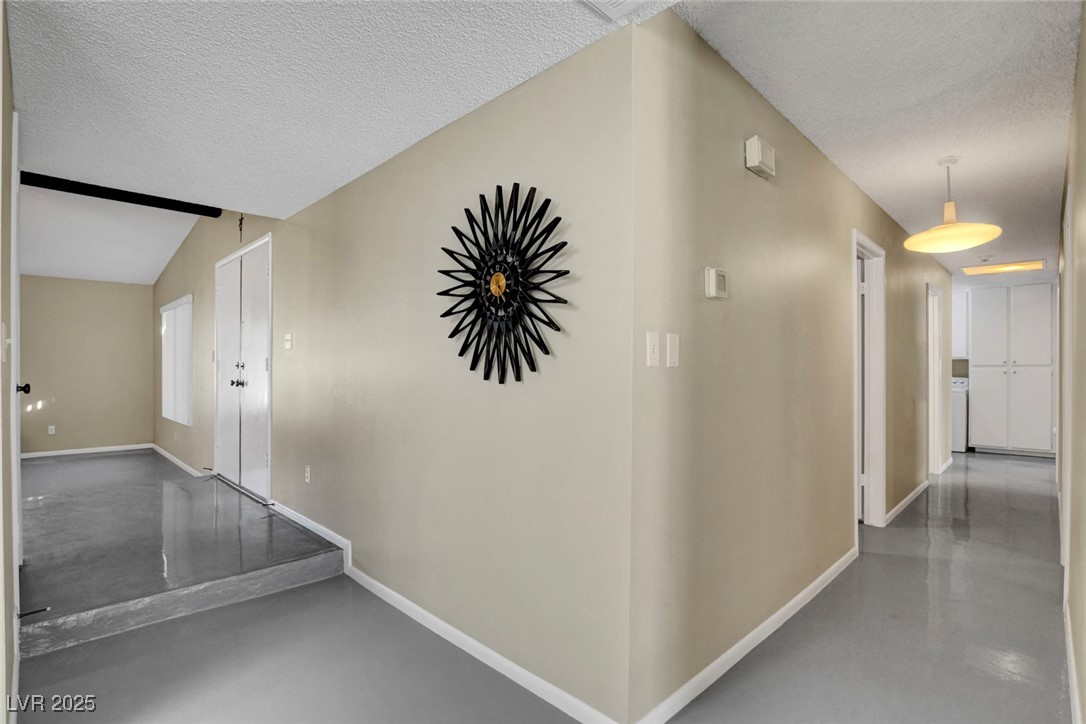 3215 Mountain Spring Road Las Vegas, NV 89146 - Photo 33 of 42 Hall with concrete flooring and a textured ceiling