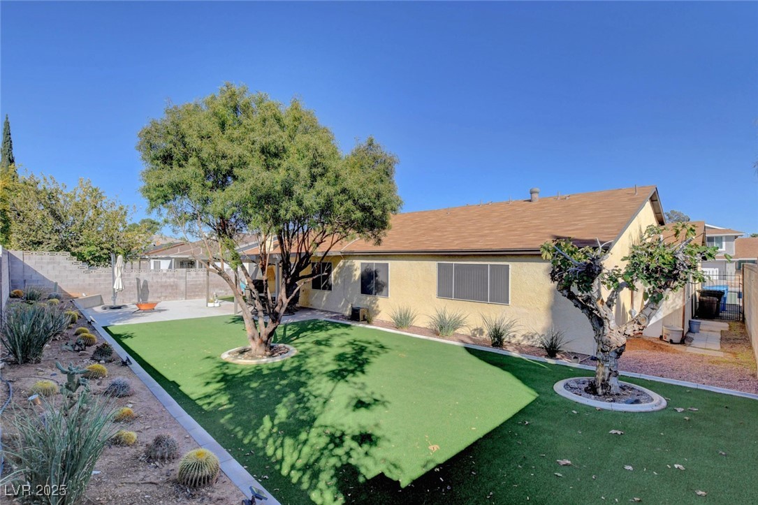 3215 Mountain Spring Road Las Vegas, NV 89146 - Photo 37 of 42 View of front facade featuring a fenced backyard, stucco siding, and a patio