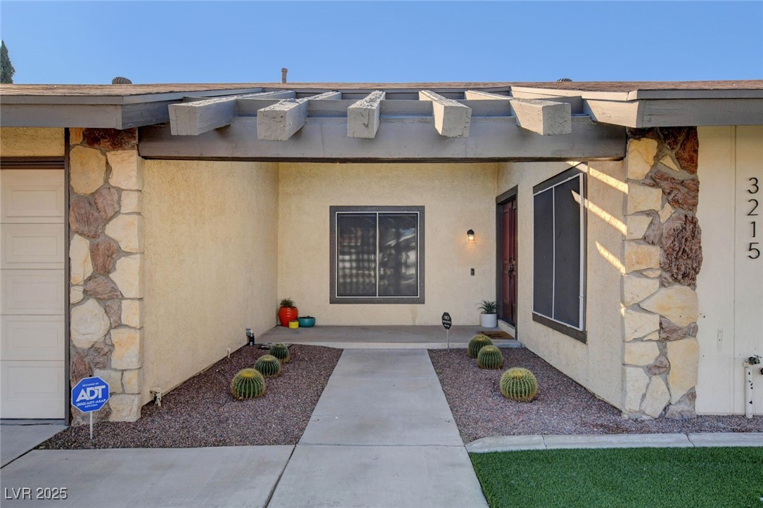3215 Mountain Spring Road Las Vegas, NV 89146 - Photo 4 of 42 Entrance to property with stucco siding