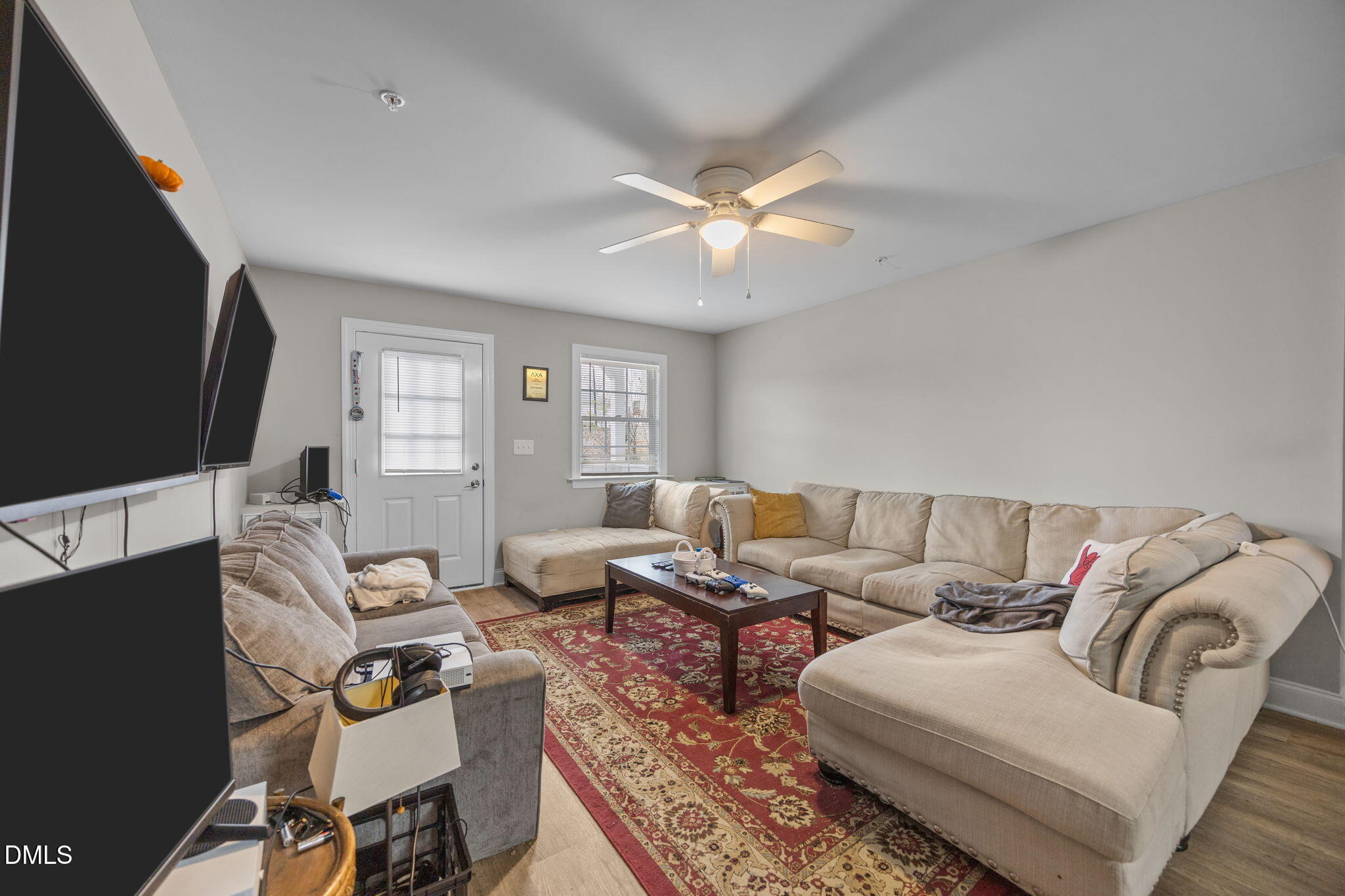 1508 Gorman Street, Unit 102 Raleigh, NC 27606 - Photo 7 of 25 a living room with furniture a ceiling fan and a window