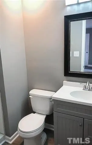 a white toilet sitting next to a bathroom sink