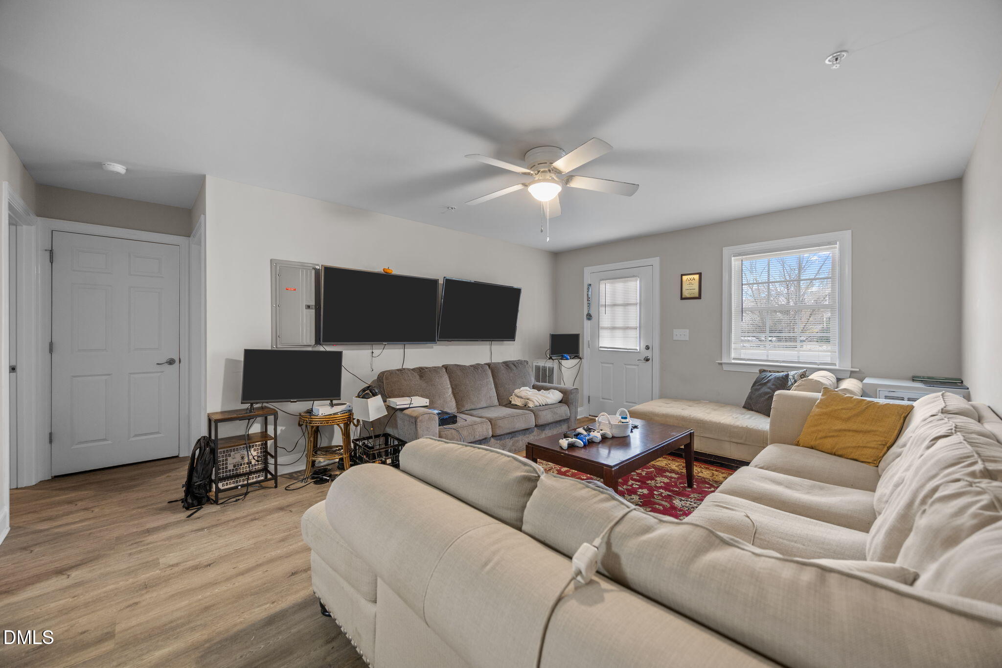 1508 Gorman Street, Unit 102 Raleigh, NC 27606 - Photo 8 of 25 a living room with furniture and a flat screen tv