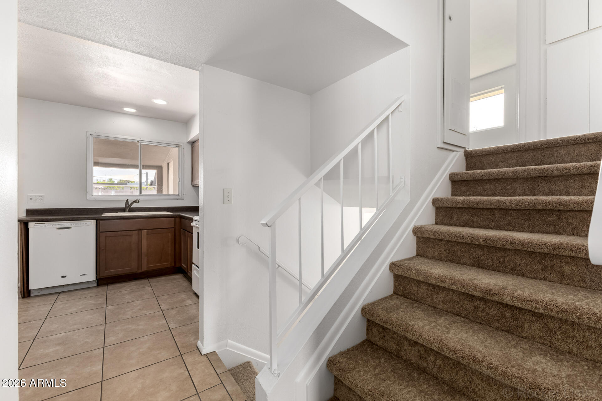 4617 South Grandview Avenue Tempe, AZ 85282 - Photo 14 of 31 a kitchen with cabinets and stainless steel appliances