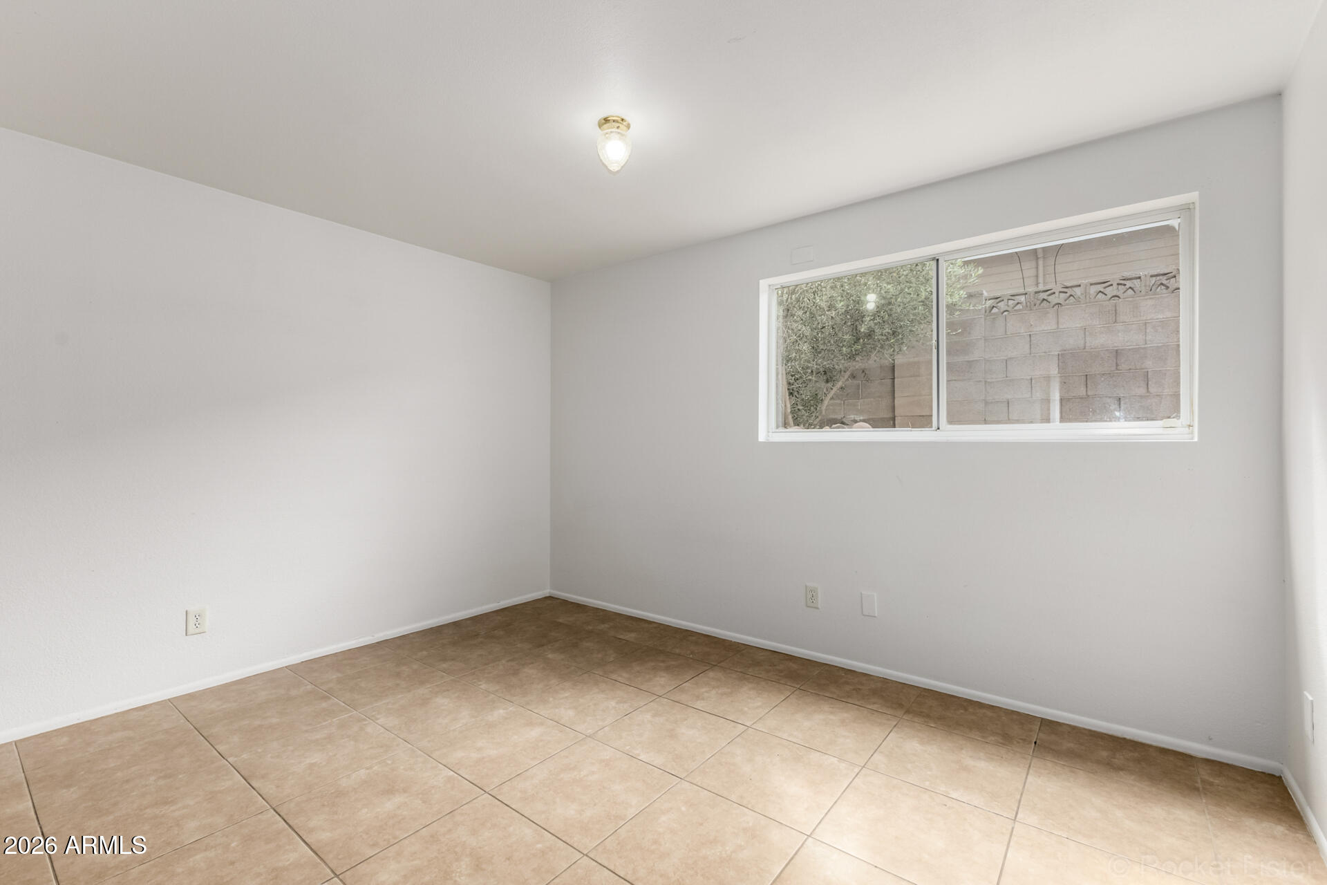 4617 South Grandview Avenue Tempe, AZ 85282 - Photo 17 of 31 a view of an empty room with a window