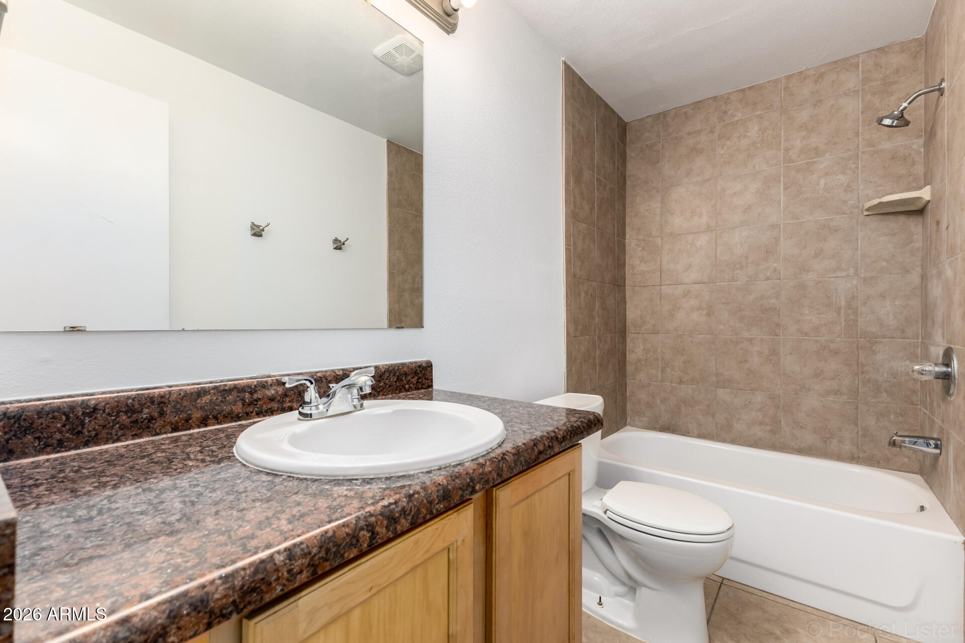 4617 South Grandview Avenue Tempe, AZ 85282 - Photo 19 of 31 a bathroom with a granite countertop sink toilet and shower