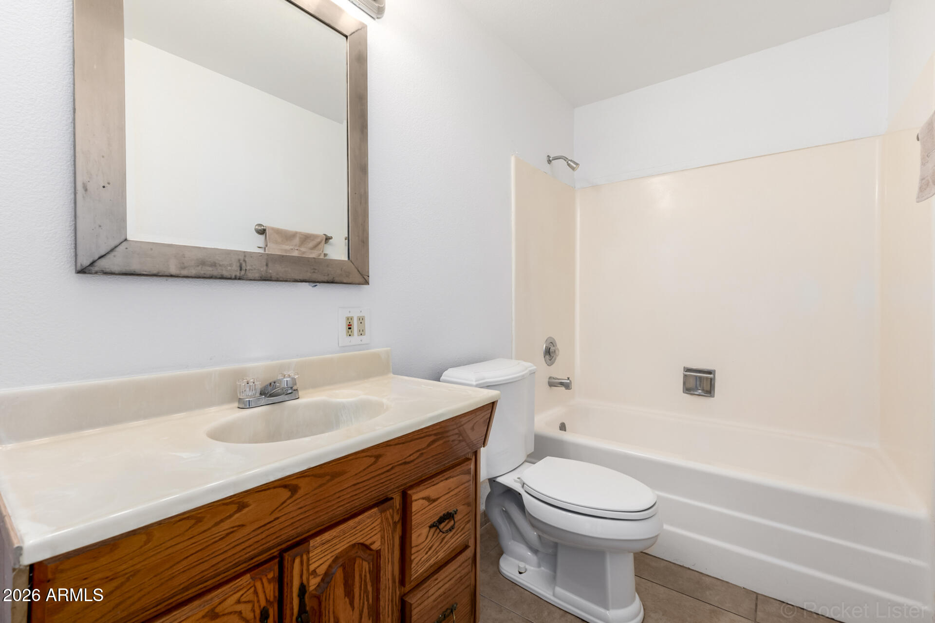 4617 South Grandview Avenue Tempe, AZ 85282 - Photo 23 of 31 a bathroom with a sink a toilet and shower