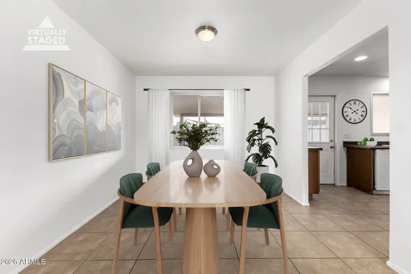 a view of a dining room with furniture and window