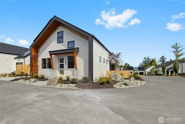 a front view of a house with sitting area